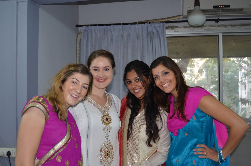 Girls dressing up for the first wedding reception in Mumbai. 